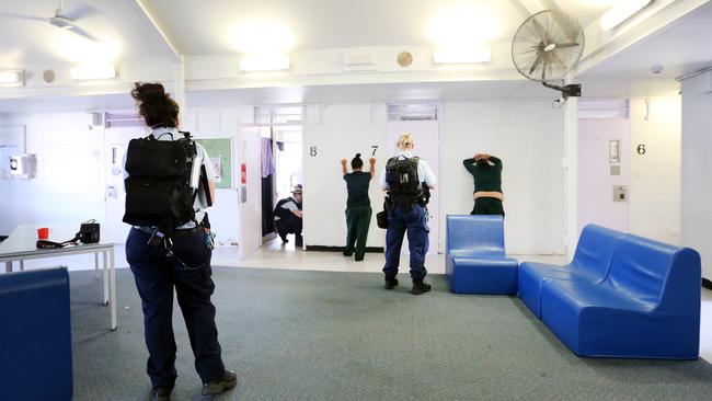 Corrections officers conduct a search of and inmates cell for looking for contraband at the Silverwater Jail women's facility. Picture: Richard Dobson