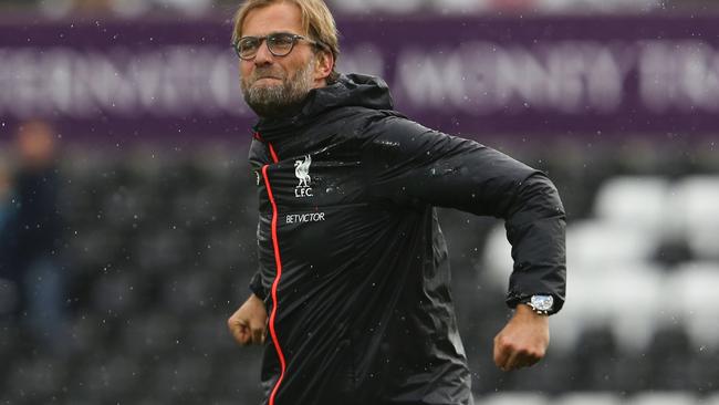 Liverpool's German manager Jurgen Klopp celebrates victory at the end of the English Premier League football match between Swansea City and Liverpool at The Liberty Stadium in Swansea, south Wales on October 1, 2016. / AFP PHOTO / GEOFF CADDICK / RESTRICTED TO EDITORIAL USE. No use with unauthorized audio, video, data, fixture lists, club/league logos or 'live' services. Online in-match use limited to 75 images, no video emulation. No use in betting, games or single club/league/player publications. /