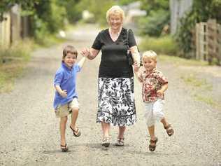 DOWN MEMORY LANE: Rio Jones, 3, Dorothea Jones and Orlando Jones, 3, walking down the laneway named after Dorothea’s late husband and the children’s grandfather, Paul Jones (inset). Picture: Mireille Merlet-Shaw