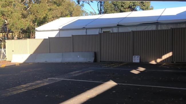 A tent in the carpark at Redland Hospital is used as a Covid ward.