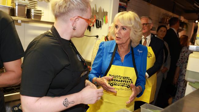 Queen Camilla assists with meal preparation during a visit to Refettorio OzHarvest Sydney on October 22, 2024 in Sydney, Australia. Picture: Ian Vogler-Pool/Getty Images