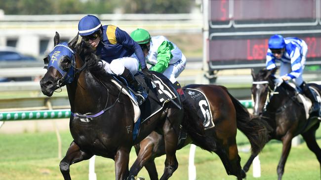 Jockey Jeff Lloyd (left) rides Betaima to victory in race 5, the Brisbane Broncos Sizzling Plate during Brisbane Broncos Race Day at Doomben Racecourse in Brisbane, Saturday, December 1, 2018. (AAP Image/Darren England) NO ARCHIVING, EDITORIAL USE ONLY