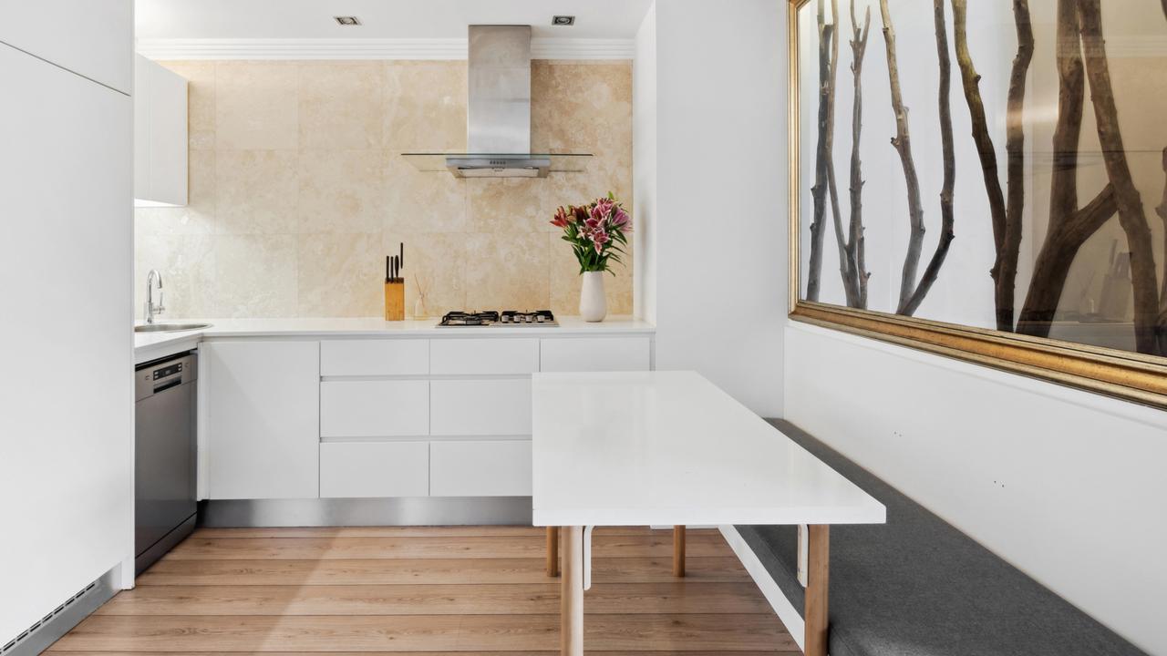 The kitchen and dining area is modern and stylish.