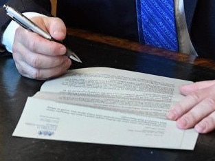 Boris Johnson posed for a picture as he signed his resignation letter