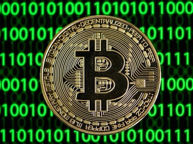 (FILES) In this file photo taken on January 27, 2020 a physical imitation of a Bitcoin is seen in Dortmund, western Germany. - German authorities said on March 15, 2023 they had taken down the "world's largest" money laundering site for cryptocurrency, seizing millions of euros' worth of bitcoin in the process. (Photo by INA FASSBENDER / AFP)