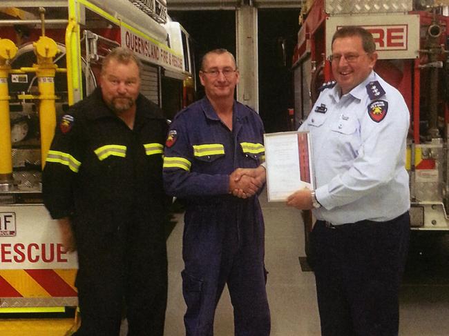 Inspector Warren Buckley (right) presents former Miles Auxiliary member Ken Brown (left) and captain Ray Duncombe with The Assistant Commissioner's Unit Commendation. Photo: Contributed