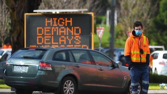 Traffic management outside a COVID-19 testing facility at Northland shopping centre in Melbourne. Picture: AAP Image/James Ross