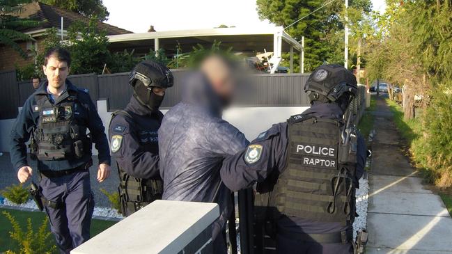 Police arrest an individual connected organised crime under Operation Hawk. Picture: NSW Police Media