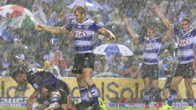 Fans copped a drenching at Belmore on Friday night. (AAP Image/Craig Golding)