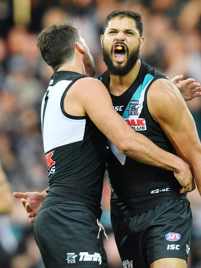 Patrick Ryder celebrates a goal with captain Travis Boak in Showdown 44. Picture: AAP Image/David Mariuz