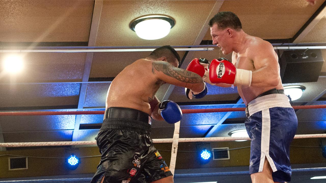 Paul Gallen and Herman Ene-Purcell fight it out in Toowoomba. Friday, Jan 29, 2016.