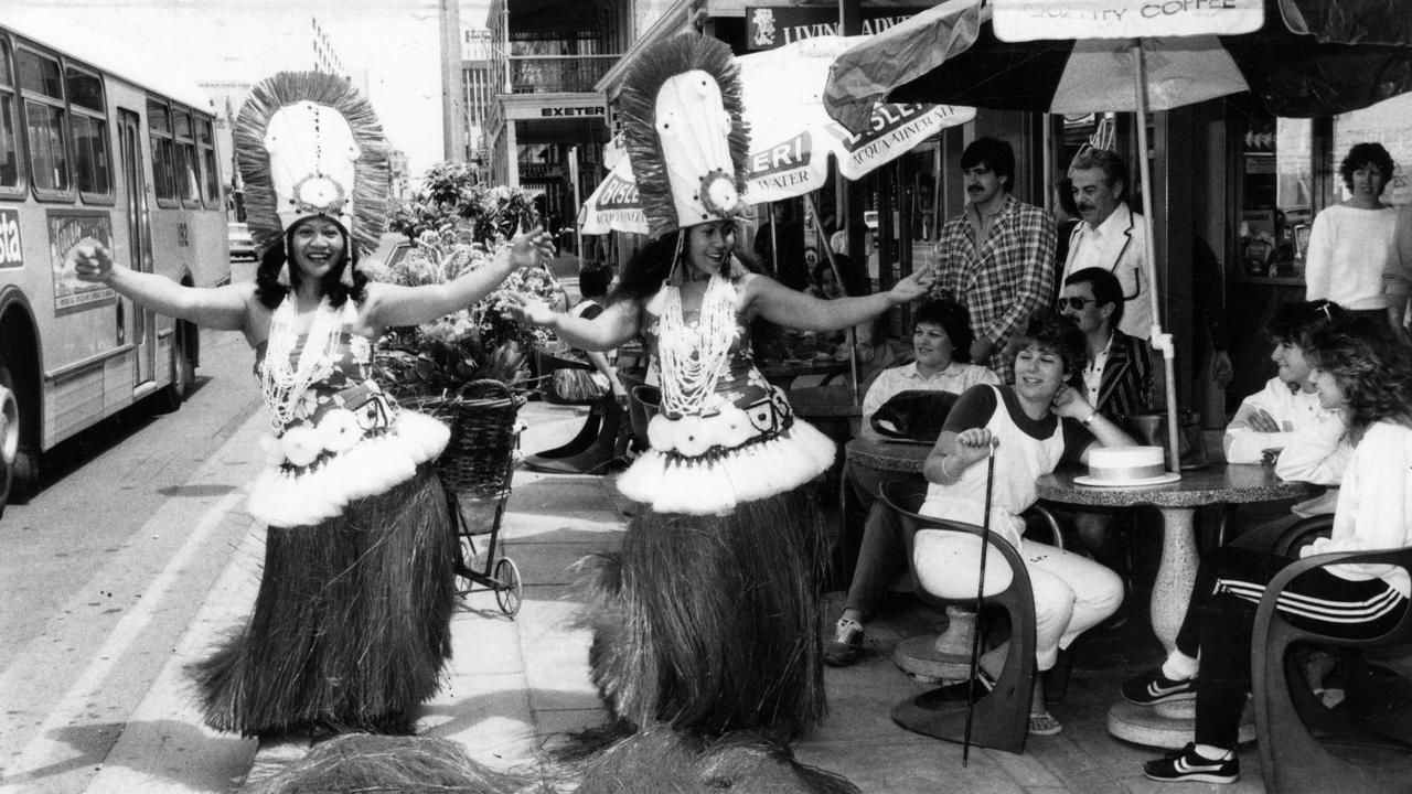 Cafe patrons watch as Rei Webster and Mata Loftus perform in a dress rehearsal for the 1983 Mardi Gras Festival on Rundle Street, Adelaide. Picture: Bob Cunningham