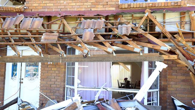A house on Leura Drive was damaged as Helensvale was smashed by a ferocious storm in Christmas night leaving a trail of destruction and 1 woman losing het life. Pics Adam Head