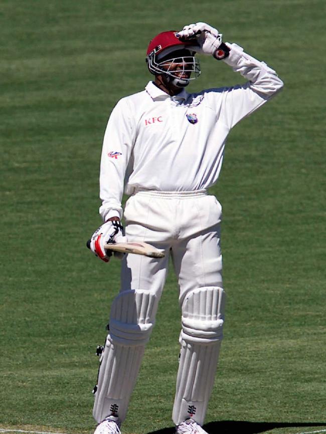 Courtney Walsh laughs at Colin Miller's blue hair during the Australia v West Indies 5th test on January 3, 2001 at the SCG.