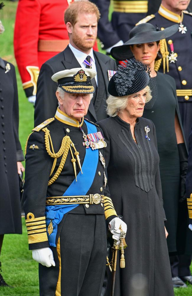 Prince Harry, Duke of Sussex, Meghan, Duchess of Sussex, King Charles III and Camilla, Queen Consort observe the coffin of Queen Elizabeth II as it is transferred from the gun carriage to the hearse at Wellington Arch following the State Funeral of Queen Elizabeth II. Picture: Getty