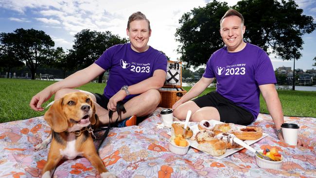 Brendan Smith and Brendon Mann with their dog Hamilton. Picture: Steve Pohlner