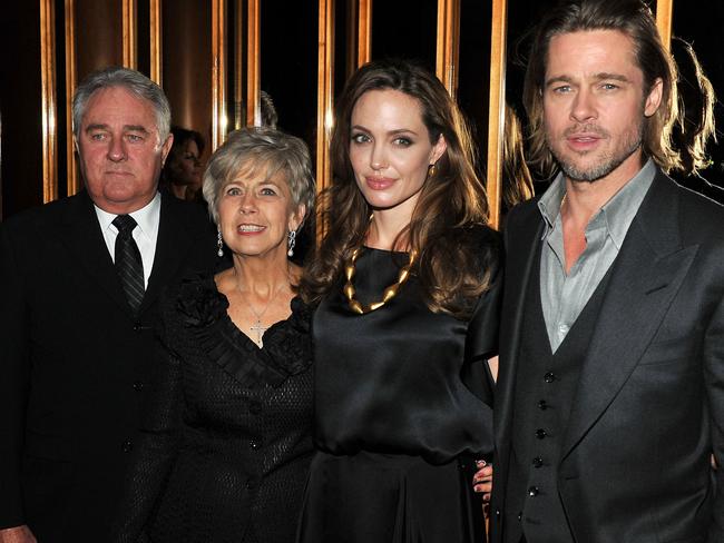 Angelina Jolie and Brad Pitt pose with Bill Ptt and Jane Pitt at the after party for the premiere of "In the Land of Blood and Honey" in 2011. Picture: Supplied