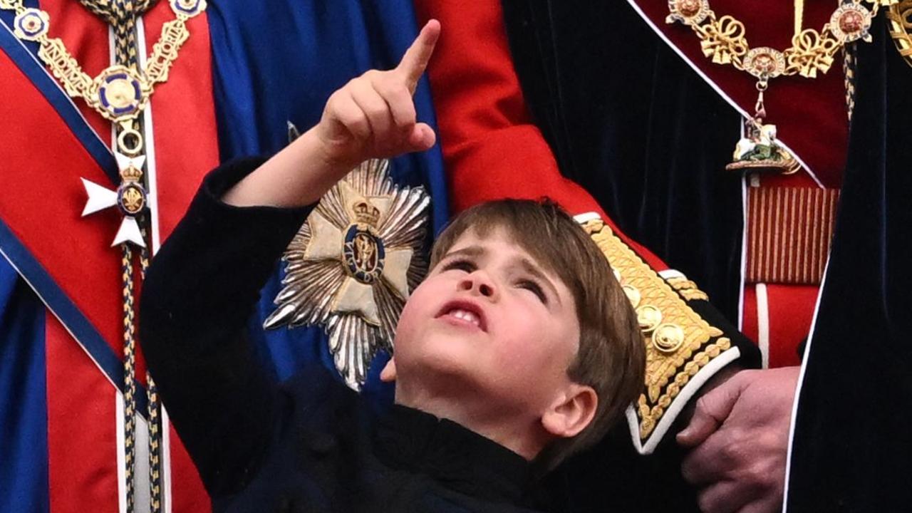 Prince Louis mimics his grandfather’s balcony moment. Picture: Oli Scarff / AFP