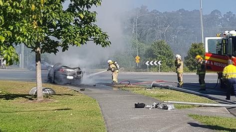 Firefighters hose down the wreck. Picture: Facebook