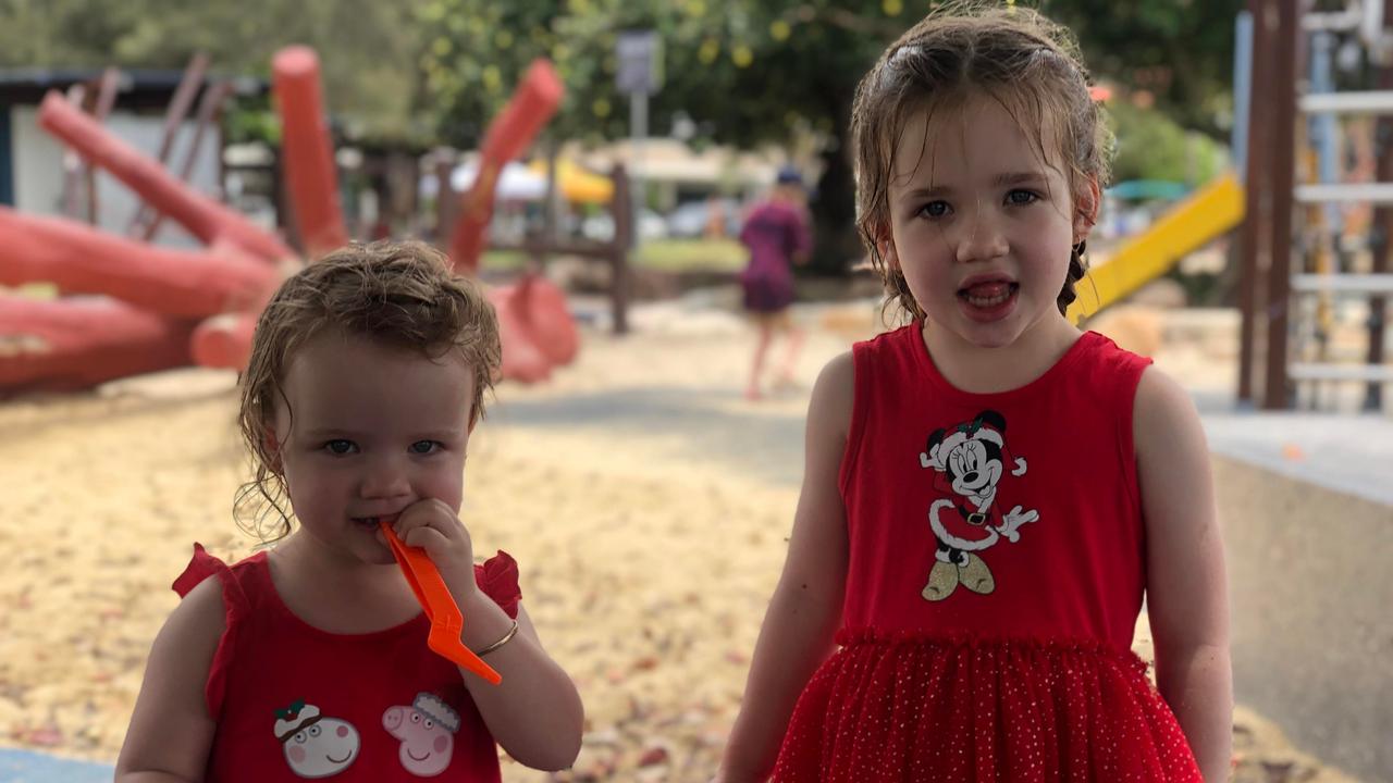 Willow and Harper Austin enjoy Christmas celebrations at Cotton Tree Park. Picture: Laura Pettigrew.