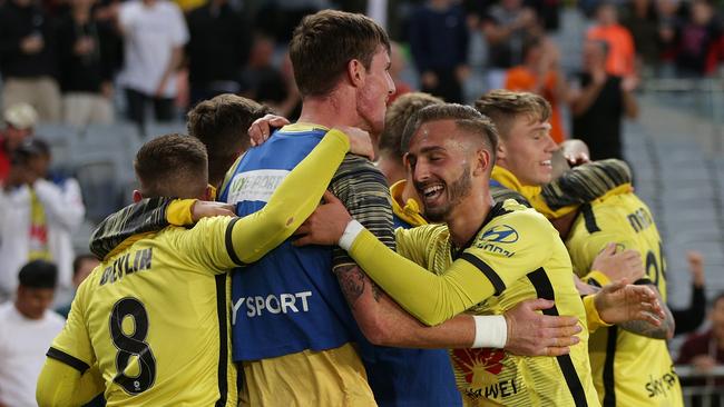 Phoenix celebrate David Ball’s goal, which would be the eventual matchwinner. Picture: AAP