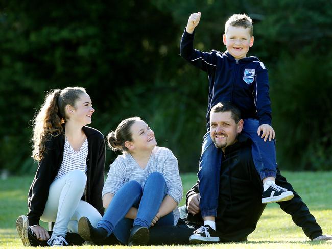 Ryan Williams enjoys an outdoors moment with children Lara 12, Ella, 10, and Caleb, 6, at Ourimbah on the Central Coast. Ryan lost weight with the help of Man Challenge. Picture: Sue Graham