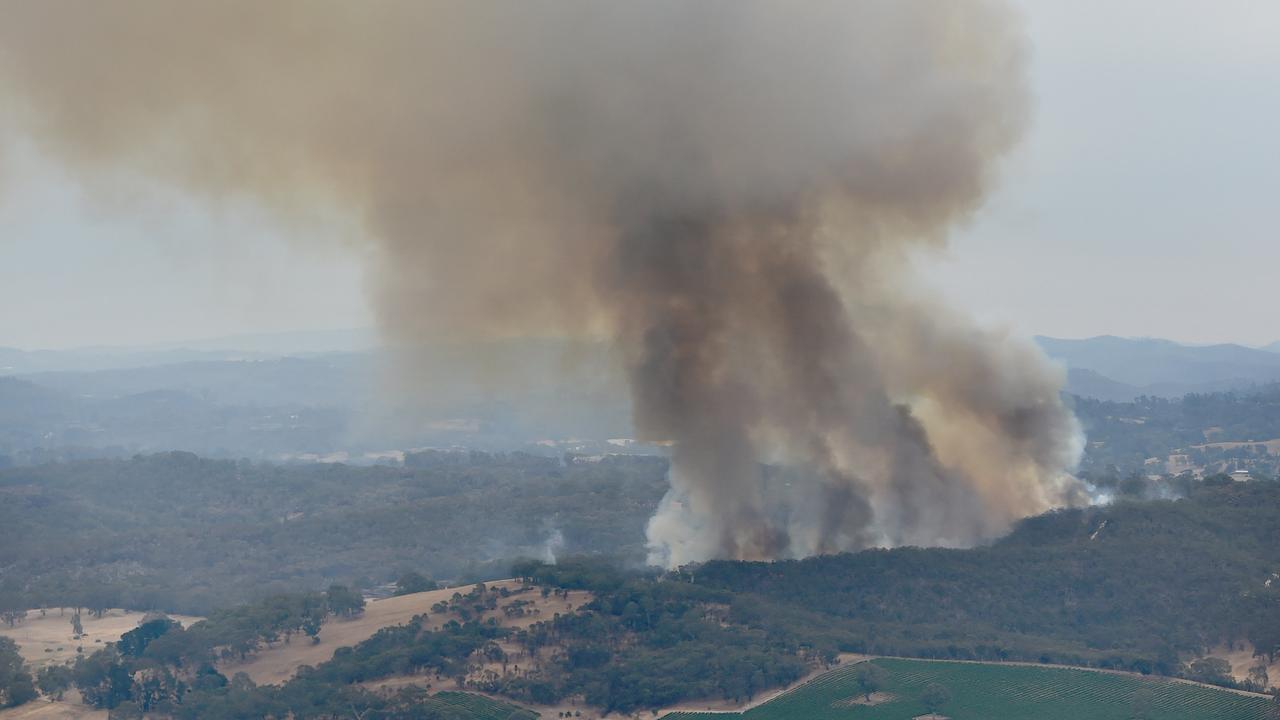 23/12/19 - Barossa Helicopters for a fly over the Cudlee Creek / Adelaide Hills bushfire zone  Picture: Naomi Jellicoe