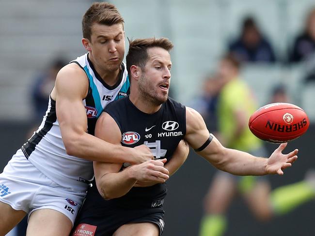 Matthew Wright of the Blues tackled by Jack Trengove of the Power.