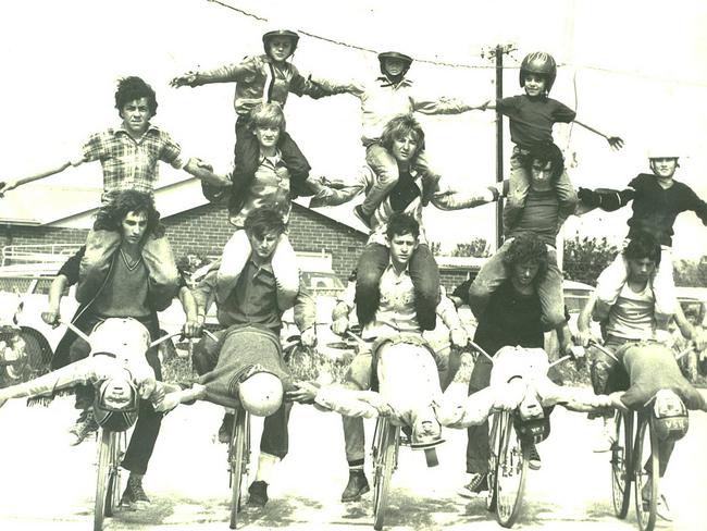 Riders form a pyramid during an exhibition of stunts at the track, in 1960.