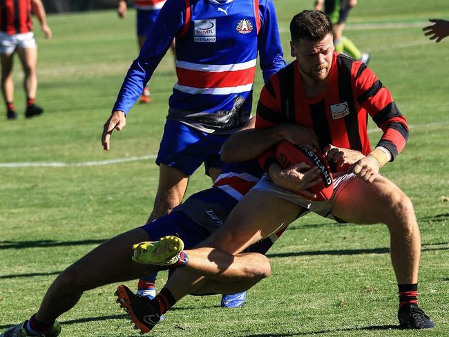 Anthony Fagan is brought to ground. Picture: Davis Harrigan