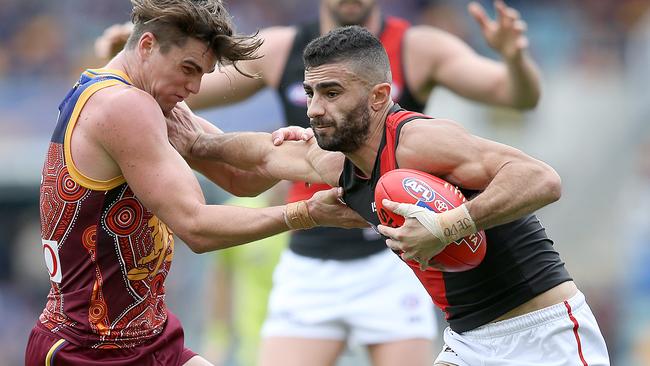 Adam Saad fends off Ben Keays during the Bombers’ win. Picture: Getty Images