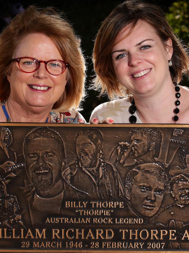 Billy Thorpe's widow Lynn and daughter Lauren with the original plaque which was stolen in 2012 but recovered aftter it was dumped in a charity bin. Picture: Norm Oorloff