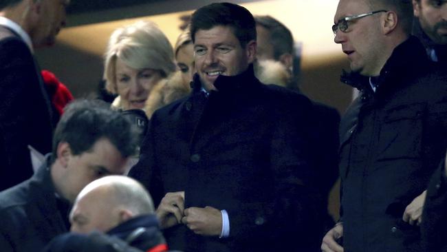 Former Liverpool captain Steven Gerrard, center, takes his seat before the English League Cup semifinal 2nd leg soccer match between Liverpool and Southampton at Anfield stadium in Liverpool, England, Wednesday, Jan. 25, 2017. (AP Photo/Dave Thompson)