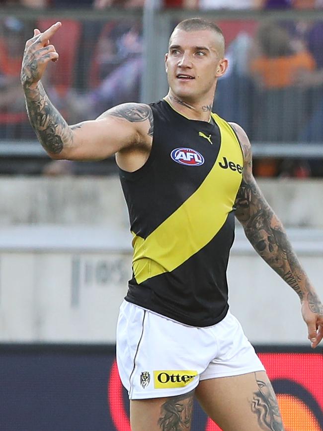 Dustin Martin says hi to a GWS opponent. Pic: Getty Images