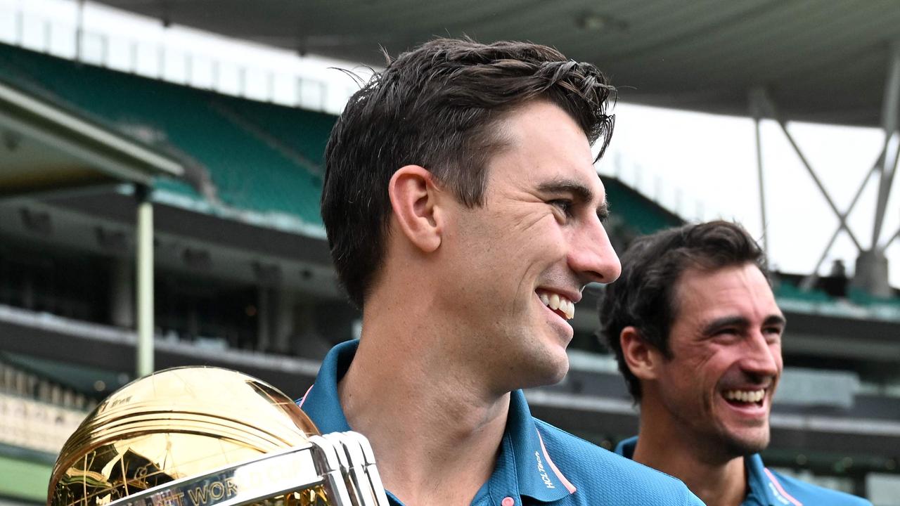Australian cricketers Pat Cummins (L) and Mitchell Starc walk with the ICC Cricket World Cup 2023 Trophy at the Sydney Cricket Ground on November 28, 2023. (Photo by Saeed KHAN / AFP) / -- IMAGE RESTRICTED TO EDITORIAL USE - STRICTLY NO COMMERCIAL USE --