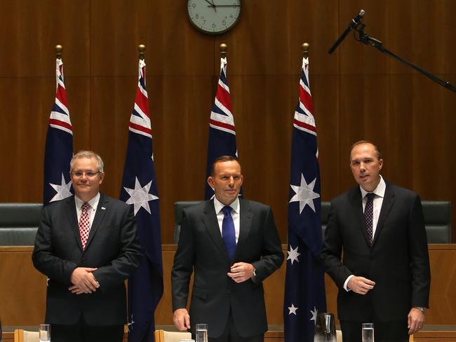 Social Services Minister Scott Morrison, PM Tony Abbott and Immigration Minister Peter Dutton meeting at Parliament House in Canberra.
