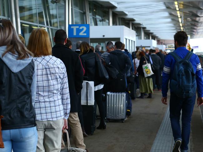 31/07/2017. People queue outside the terminal due to Increased delays at Sydney domestic airport as travellers are warned to arrive two hours earlier for flights because of Òadditional scrutinyÓ after authorities foiled a terrorist plot to bring down an aircraft using an improvised device over the weekend. Britta Campion / The Australian