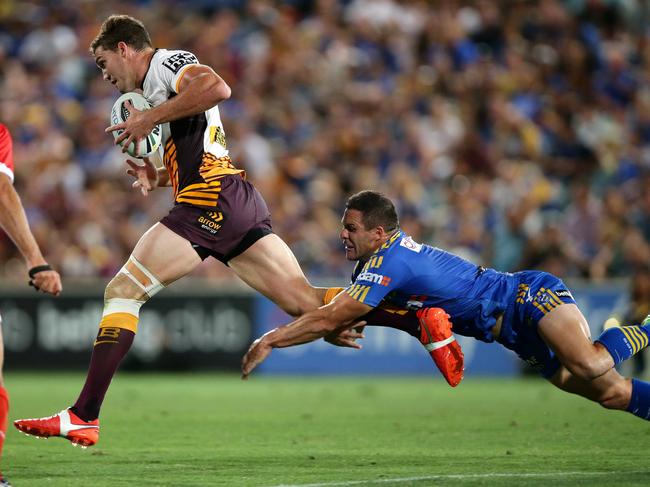 Bronco's Corey Oates makes a break during the round 1 NRL game between the Parramatta Eels and the Brisbane Broncos at Pirtek Stadium ,Parramatta.Picture Gregg Porteous