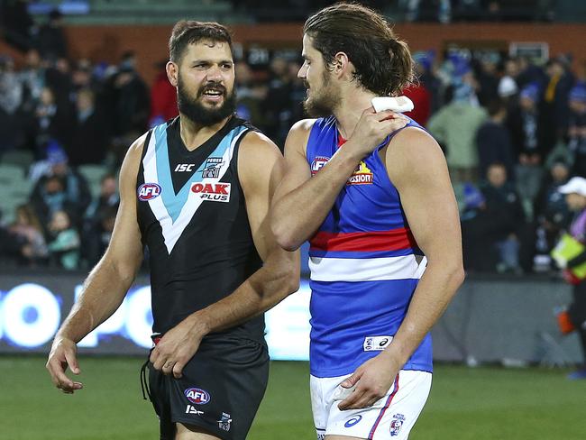 Paddy Ryder talks with an injured Tom Boyd after the match. Picture SARAH REED