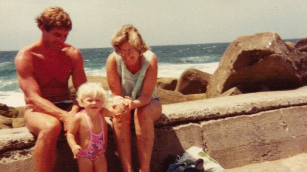 Shanelle Dawson on the break wall at Clovelly in 1979, with mother Lynette and Chris Dawson.