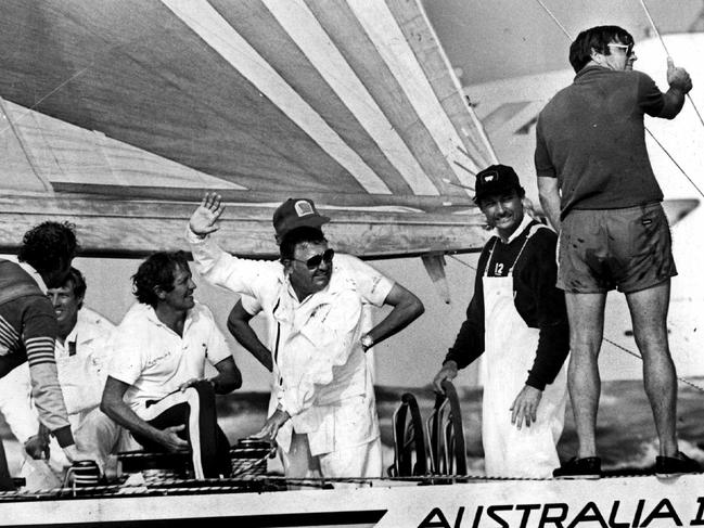 Australia II keel designer Ben Lexcen, right, on board the America’s Cup-winning vessel in 1983 with businessman Alan Bond, centre, and skipper John Bertrand at the helm.