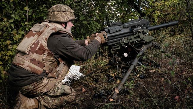 A soldier of Ukraine's 5th Regiment of Assault Infantry fires a US-made MK-19 automatic grenade launcher towards Russian positions less than 800m near Toretsk in the Donetsk region. Picture: AFP