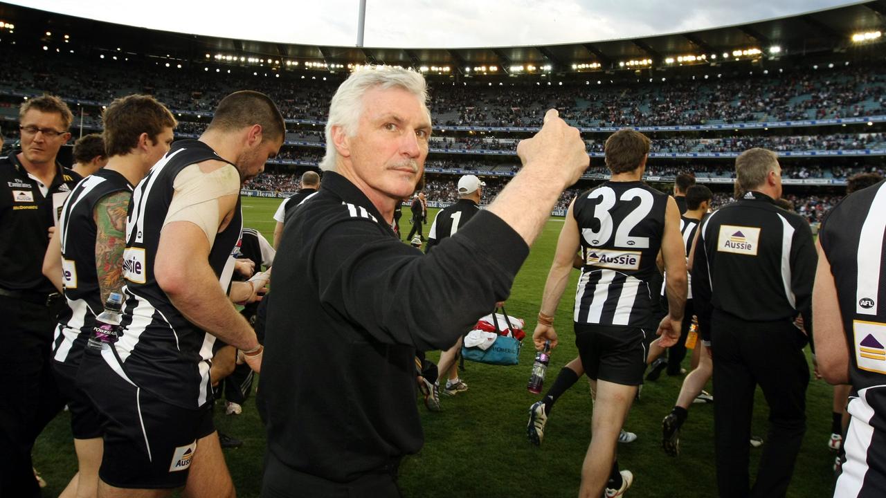 Mick Malthouse rallies the troops to head to the rooms after the drawn game.