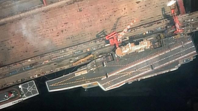 Type 001A in a recent photo of it tied up at its constructors' wharf, with its trials support ship ahead. Picture: PLAN