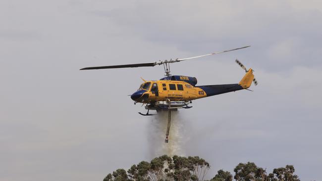 Helicopters douse the fire. Picture: Jenny Evans