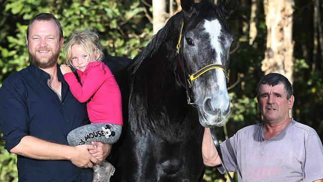 Racehorse owner Chris Jorgensen and his daughter Athena with his horse Taveuni and Cairns Trainer Rodney Miller. PICTURE: STEWART MCLEAN.