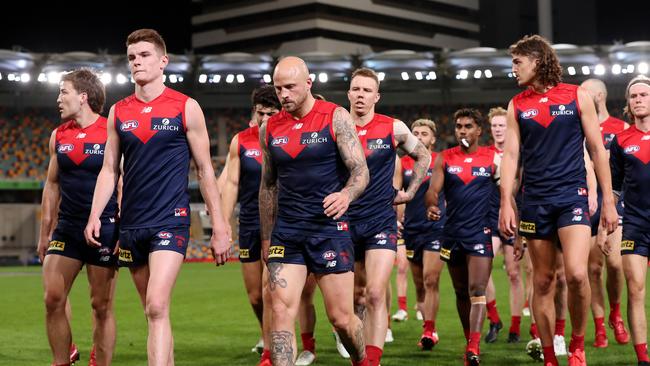 The Demons trudge off the Gabba after being easily beaten by Port Adelaide. Picture: Michael Klein