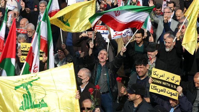 Iranians wave Palestinian, Hezbollah and national flags, as they celebrate a Gaza ceasefire deal during a rally after the Friday noon prayers in Tehran on January 17, 2025. Picture: AFP