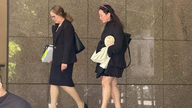 Caitlin Schiavone, right, leaves the Melbourne Magistrates Court. Picture: Mohammad Alfares