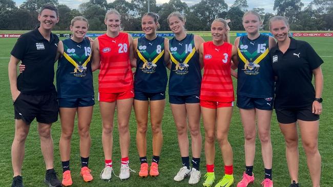SA under-18s coach and National Academy assistant coach Brad Snell (left) with top SA players Sophie Eaton (Central), Charli Hazelhurst (Norwood), Eloise Mackereth (Glenelg), Lily Baxter (South Adelaide), Mikaylah Antony (Central), Monique Bessen (Sturt) and National All-Stars physical performance coach and SA female talent physical performance coordinator Zianna Chesterfield at the National Academy v All-Stars game in Melbourne in April. Picture: SANFL